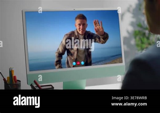 Businessman talking video meeting working office computer closeup. Over shoulder view unknown man making pc videocall talking with travelling coworker on screen. Guy watching travel blog online Stock Video Footage - Alamy