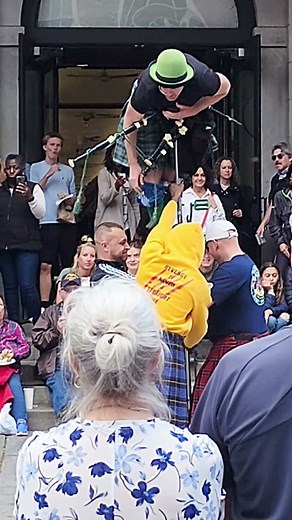 Unicycle High Jinks: Street Performer's Daring Trick at Faneuil Hall!