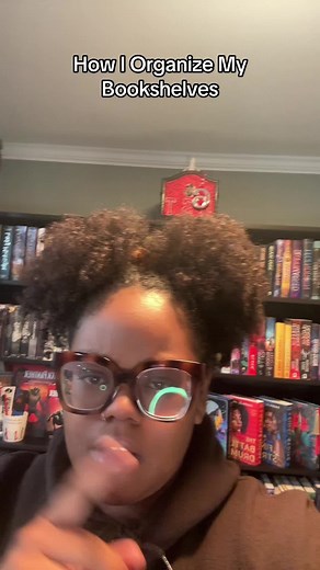 I swear no other system for organizing a bookshelf is better than mone point blank period. And I can def do a more in depth vid if folks want the whole breakdown #BookTok #bookshelf #bookshelforganization #blackfantasybooks #diverseauthors #blackbooktok #blackauthoredfantasybooks #targetaudience #fantasybooks #bookrecs How to organize bookshelves