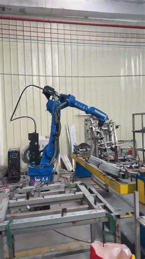 WMT Furniture's automated welding workshop with robotic arms