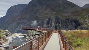 Viewpoints beyond the mountain edge enable tourists unique views on the waterfalls, mountains and hairpin turns of Troll's ladder in Norway, the Trollstigen pass is open only during summer