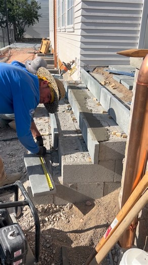 Installing bluestone steps at the entry. ✨ Follow along for more progress! #Bluestone #StoneSteps #CustomHome #HomeBuild #BearLakeBuilder | Smart Construction