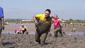 People race over the bed of the River Blackwater for The Maldon Mud Race
