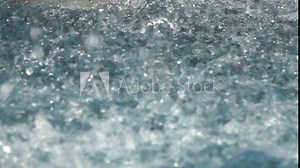 The bubbling of the water (boiling water, whitewater) accompanied by a multitude of flying droplets and foam, stochastic motion. Super slow motion 1000 fps Stock Video