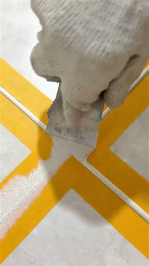 efficient floor tile grouting activity using specialized grout applicators