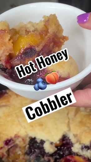 Here’s a DELICIOUS dessert for your hot honey! He or she will LOVE!Just add 20 oz bag of frozen peaches, a heaping cup of frozen blueberries, 1 tbsp. Of cornstarch, 1 tsp. Of vanilla, a sprinkle of cinnamon, and two tbsp. Of hot honey! I use @naturenates! Mix it all together Then sprinkle over 1 box of white cake mix (don’t mix it) slice over a stick of butter on top of the cake mix. Set the crock pot to high and let it go for about 2.5 hours or so! I served with a scoop of cool whip drizzled wi