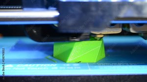 Closeup 3D printer builds up the object with hot molten plastic. The progressive modern additive technology 3D printing. The 4ht industrial revolution.