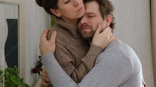 Loving mature couple interactions at home. Man and woman embracing, hugging, holding hands and dancing. Wife with husband intimate moments. couple is touching, cuddling, kissing. Natural lighting. 4K