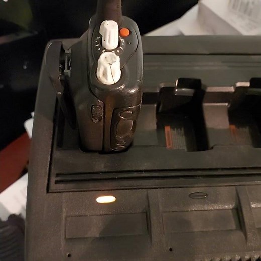 Solid yellow light on Motorola walkie talkie charger - what does it mean?