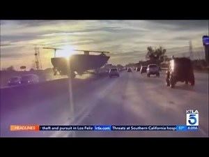 Boat launched over center divider, lands in opposing lanes on 91 Freeway