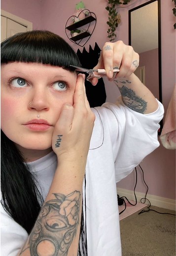 How I cut/trim my baby bangs at home! We are in mullet territory at this point but I really dont mind. #altgirl #alttiktok #blackhair #babybangs #haircut #bangstutorial #haircuttutorial #microbangs #althairstyles