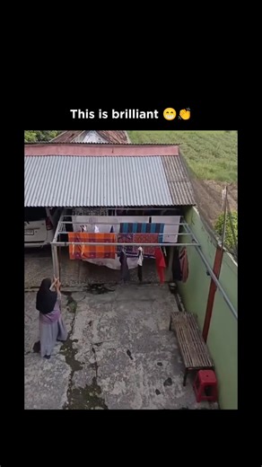 Dark Vids on Instagram: "Wait for end A short-form compilation circulating in 2026 documents a practical household engineering solution used in rural and suburban regions prone to sudden tropical rain. Each clip centers on an outdoor laundry setup positioned beneath corrugated metal roofs or narrow sheltered overhangs, with clotheslines mounted on sliding rails or pulley-based tracks. The framing is consistent: a person notices a shift in weather—darkening clouds, wind picking up, or the first d