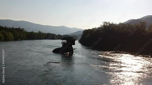 Lonely old wooden house on the Drina river in Bajina Basta, Serbia, Aerial Nostalgia and sentimentality concept.