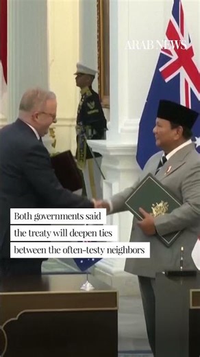 Leaders of Indonesia and Australia sign a new security treaty to affirm deeper ties