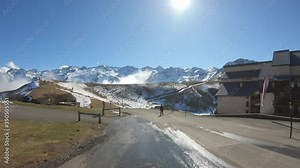 Bagnères-de-Luchon / France - March 13, 2020: DOLLY SHOT - The Luchon Superbagnères Ski Resort in the Arrondissement of Saint-Gaudens, Occitania, Haute-Garonne, France.