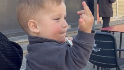 Little boy makes an obscene gesture after his ball is taken