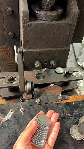 Real Engineerings | Engineering & Technology & Gadgets & DIY on Instagram: "The Rhythm of Riches: Witnessing a Coin Strike in Action! 💰✨ ​Step into the fascinating, precise world of metal stamping! This video captures the moment a blank metal disc—known as a planchet—is transformed into a finished coin or medallion using a heavy-duty hydraulic or mechanical striking press. ​The Power of the Press ​This process is about delivering massive force in a single, controlled strike to imprint complex d