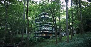 hiding glass house in japanese forest sees 360 degrees through all-round windows