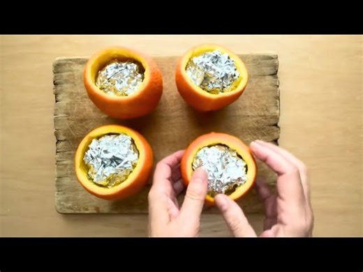 She stuffs silver foil into orange peels for this genius window idea!