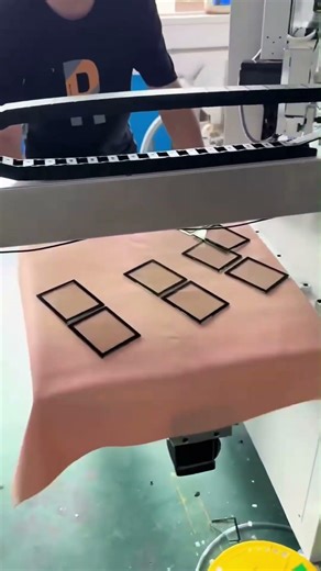 6-WorkStation Screen Printer with automatic robotic unloader in action—printing on window glass.