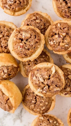 PECAN TASSIES are mini pecan pies inside a homemade (3 ingredient) flaky cream cheese pie crust. Made in a mini muffin pan so they’re perfectly bite-sized and poppable. . . . Grab the recipe here —-> https://togetherasfamily.com/pecan-tassies-recipe/ | Together as Family - Recipes from my family's kitchen to yours