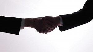 Business handshake - Hand holding on white background