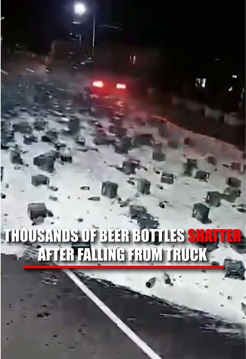 Thousands of bottles of beer suddenly came crashing onto a highway after a truck's cargo shifted mid-drive. Video shows stacks of green crates toppling off the trailer and exploding across the road, covering the pavement in shattered glass and spilled beer. Officials say 1,944 cases fell from the truck after it reportedly lost balance along the roadside in the Philippines. Despite the massive mess and blocked roadway, no injuries were reported.