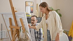 In an art studio, two focused artists - a man and woman, intently draw on canvas, deepening their bond and igniting creativity