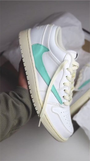 J1 “Tiffany” Custom 🌌🪐 We're taking a break from basketball shoes! This time, it's a reversed swoosh Jordan 1 custom, with Tiffany-colored swooshes matched with an aged white look. We swapped the tongue to a slimmer nylon material. This colorway was specifically requested by our client, Sir @archpopoy, and we made it happen! 🫶 Base pair: Jordan 1 Retro Low Paints: Angelus Paint Leather from: Veg tanned Custom Kicks | @aj.customkicks Tags: #travisscottcustom #ts #reversedswoosh #jordan1custom 