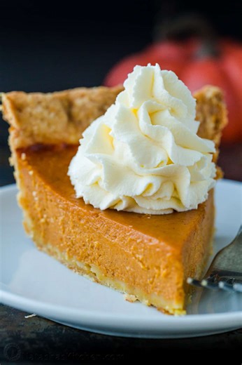Thanksgiving wouldn’t be the same without a classic Pumpkin Pie Recipe for dessert, topped with homemade whipped cream. Recipe: https://natashaskitchen.com/pumpkin-pie-recipe/ | NatashasKitchen.com