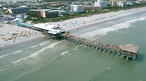 Drone video: Surfers, beachgoers at Cocoa Beach Pier, great place to watch rocket launch