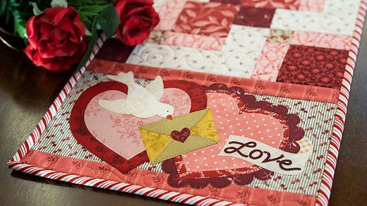 Combining two of our favorite techniques, fun piecing and appliqué, the Easy Pieced Table Runner for February features a peaceful Dove delivering a love note on Valentine’s Day! Jen will walk you through measuring, cutting, and creating the simple double disappearing 9-patch block. Download the free pattern here: https://www.shabbyfabrics.com/Free-Downloads-W4C258.aspx _____________________________________________________________ -------- WHAT YOU NEED FOR THIS PROJECT -------- - Easy Pieced Tab