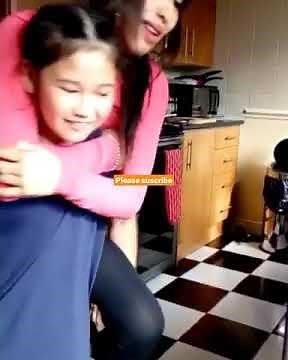little girl piggyback mom