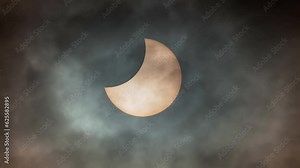 Solar eclipse view through a telescope and a special solar filter.