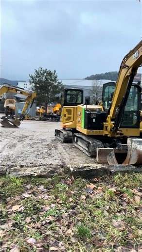 A Dozen Identical Diggers Standing Like Clones