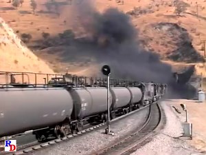 Oil cans are emerging from tunnel #5 with lots of SP power. From the WB Video Productions show on 2 discs "Tehachapi - 1988" https://rfd.video/T1988 | Railfan Depot
