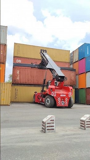 Kalmar Reach stacker with a tilting spreader for container handling