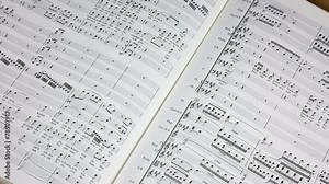 Sheet music with conductor's baton
