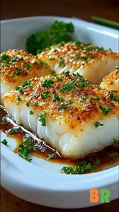 Easy Boston Baked Cod Flaky cod is oven baked under a crisp, buttery Ritz cracker crust enriched with parsley, lemon, and Parmigiano-Reggiano. This classic New England preparation relies on gentle heat and balanced seasoning to preserve moisture while developing a golden, savory topping. 🛒Ingredients : Fish: 1 pound cod or other white fish fillets Seasonings: Kosher salt, to taste Fresh cracked black pepper, to taste Topping: 35 Ritz crackers, finely crushed 6 tablespoons unsalted butter, melte