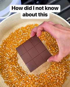 Easy chocolate popcorn Liz combines popcorn and chocolate on a bed of coconut oil to make a yummy chocolate popcorn snack. Be sure to oil generously and mix and shake often to prevent sticking. This original video was produced by Network Media LLC, and Liz & Jeff. #popcorn #chocolatelover #snacks #sweetandsalty | Liz & Jeff