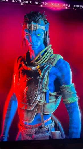 He’s staring into my soul… I am truly invested into this storyline. From the Ashes DLC has me completely wrapped up in So’lek’s world — those piercing blue Na’vi eyes cutting through the industrial haze, bow drawn taut against the flickering firelight, every bioluminescent detail pulling me deeper into Pandora’s resistance. The rusted pipes loom overhead, the air hums with tension, and I can’t look away. This is the kind of storytelling that makes cozy winter nights feel like epic adventures. #h