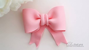 There is nothing I love more than adding pretty bows onto cakes! If you have ever wondered how to make a gumpaste bow, here is a sneak peak from one of my Free video tutorials: https://youtu.be/uDigd_noH3E | Cakes by Lynz
