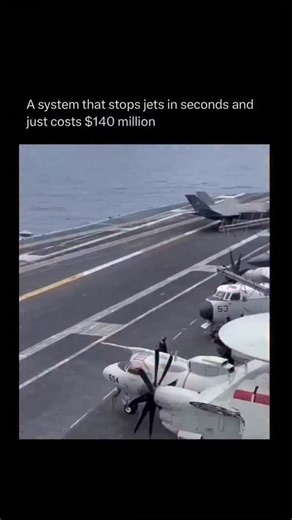 Rest is History on Instagram: "An aircraft carrier's landing system is one of those things that feels almost unreal when you think about it. It can take a fighter jet screaming in at over 150 miles per hour and bring it to a complete stop in just a few seconds. As the jet touches down, a tail hook slams into one of the thick steel cables stretched across the deck. That split second catch sends all that momentum into massive hydraulic systems hidden below, which smoothly absorb and control the en