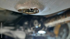 the exhausted oil flows out of the engine carter