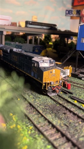 A set of big GE’s running light sneaks pass some needed track work in Kanesville.