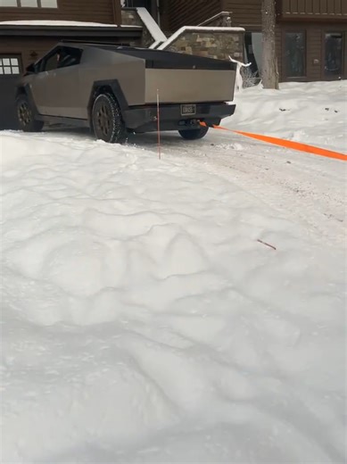 Cybertruck Towing a Box Truck in Snowy Conditions