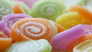 A close up of colorful candy that is arranged in a circle