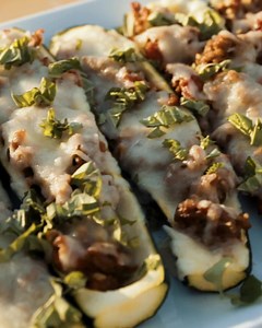 Trick them into eating veggies - zucchini boats with layers of smoky & cheesy flavor from Masterbuilt & Kingsford Shop what you need at Walmart. Italian Sausage Stuffed Zucchini Boats ⬇️ Ingredients ● 4 zucchini, cut lengthwise ● 1 pound Italian sausage ● 2 cloves garlic, minced ● 1 small can Italian style diced tomatoes, drained ● 16 ounces mozzarella cheese ● 1 small bunch of basil leaves, chopped for garnish Instructions 1. Slice the tips off the zucchini and then slice lengthwise. Remove the