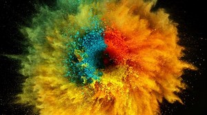 Super slow motion of coloured powder rotation isolated on black background. Filmed on high speed cinema camera, 1000fps.