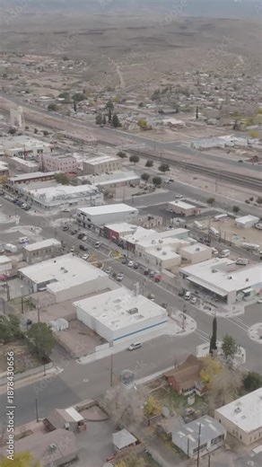 Vertical drone orbit shot circling a Route 66 sign in Kingman Arizona capturing smooth aerial motion classic highway history and travel storytelling